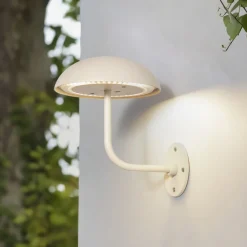 Arcchio LED ladattava pöytävalaisin Thenra, beige, seinäkiinnike