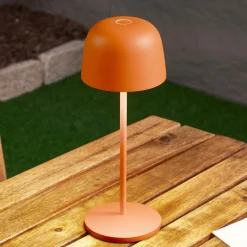 Lindby LED-akku-pöytävalaisin Arietty, oranssi, himmennettävä, IP65