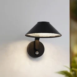 Lindby LED-seinälamppu Capelo, musta, metalli, anturi, Ø20cm