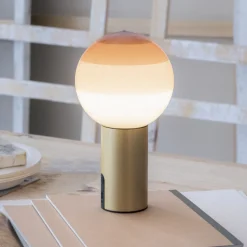 MARSET Akku-pöytälamppu Dipping Light, kerma/messinki, himmennettävä